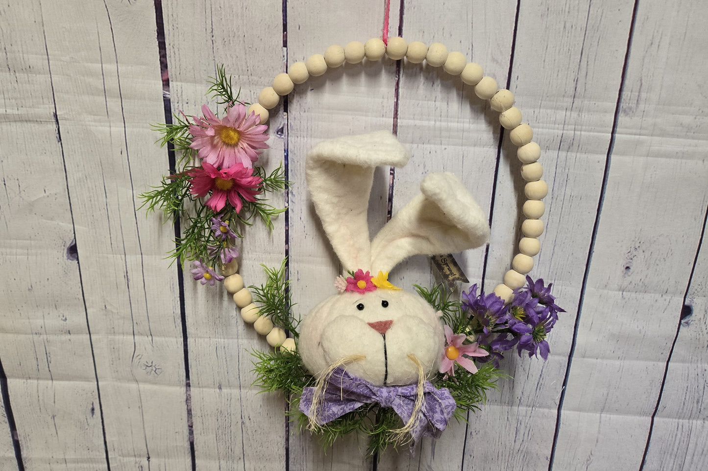 12 Inch Boho Wood Bead Easter Bunny Wreath – Modern Farmhouse Spring Door Hanger – Handmade Plush Rabbit with Floral Accents and Purple Bow