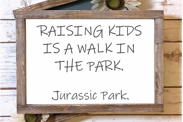 Raising kids is a walk in the park family wood sign