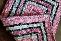 pink and black locker hook rug